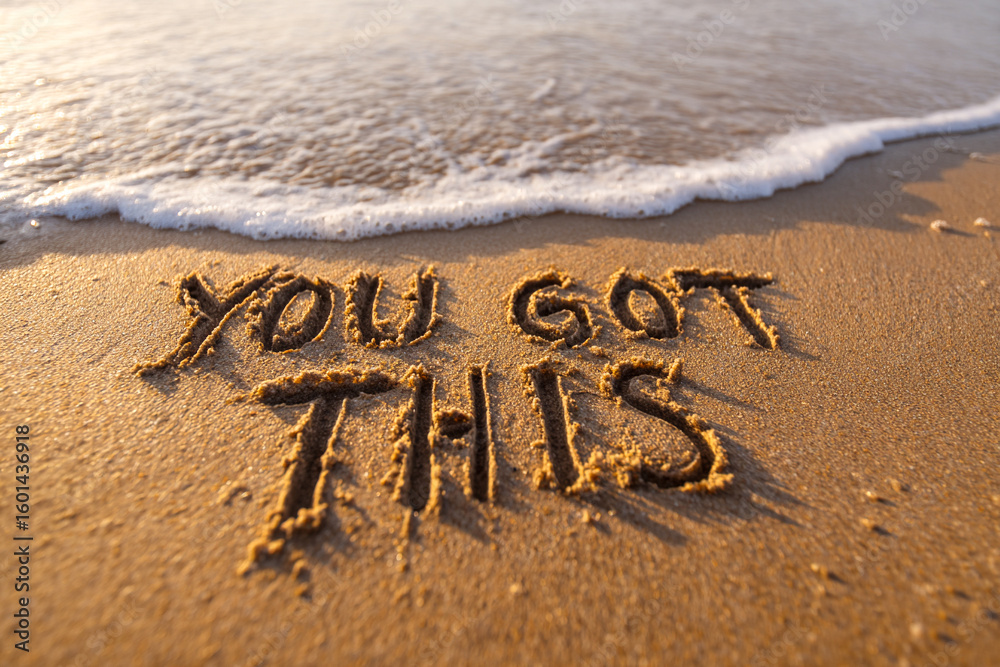 Fototapeta premium Motivational Scene of YOU GOT THIS Written in Wet Sand with Ocean Foam at the Base in Clean Horizontal Layout