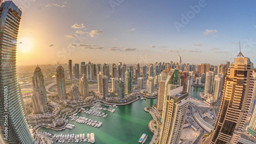 Fototapeta Naklejka Na Ścianę i Meble -  Dubai Marina skyscrapers and jumeirah lake towers view from the top aerial timelapse in the United Arab Emirates.