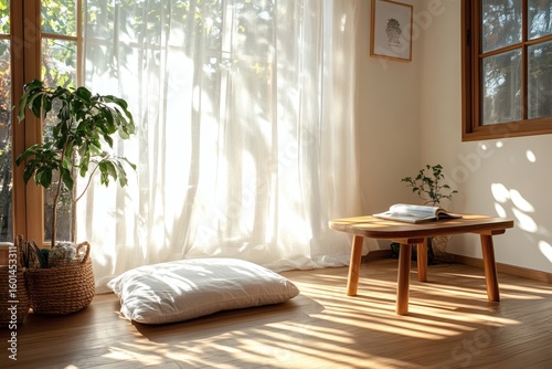 A sunlit indoor scene with a wooden table and a comfy floor cushion
