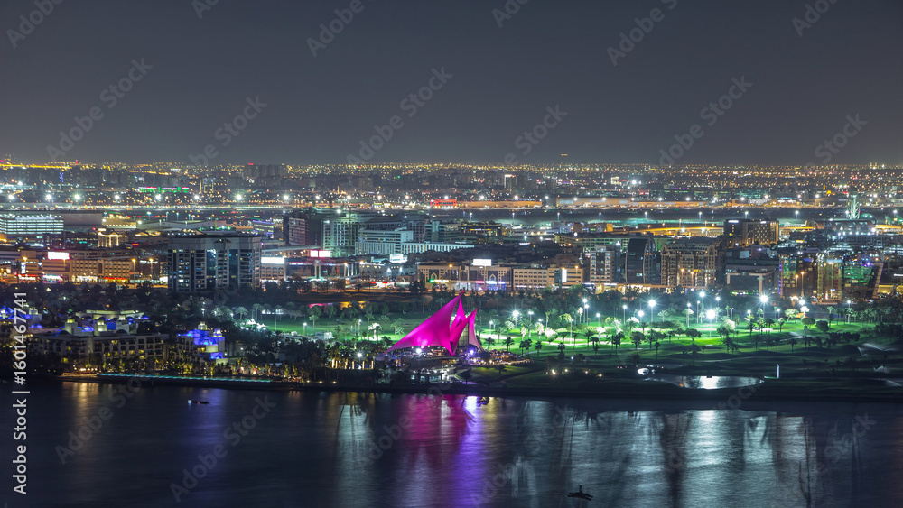 Obraz premium The rhythm of the city with lights from buildings and illuminated roads aerial timelapse