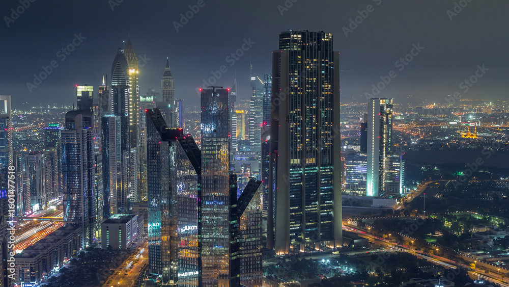 Naklejka premium Dubai International Financial Centre district with modern skyscrapers night timelapse
