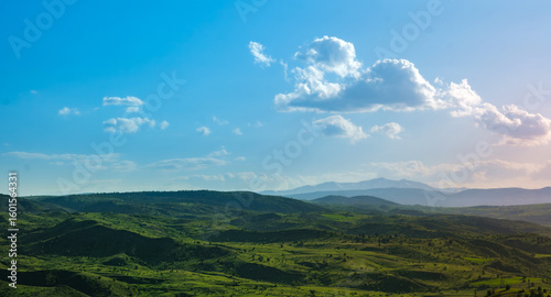 Photos Rolling green hills under dramatic cloudy sky