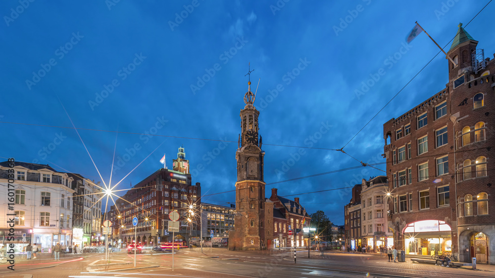 Naklejka premium Munttoren tower and flowers market. Panoramic day to night timelapse hyperlapse of Amsterdam city center. Netherlands
