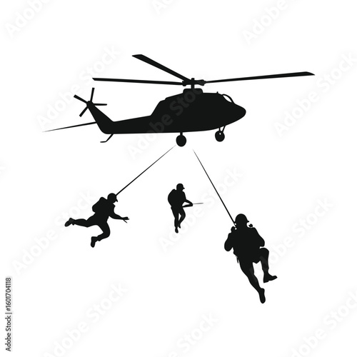 Helicopter hovering in the sky with a rope descending to a soldier on the ground below