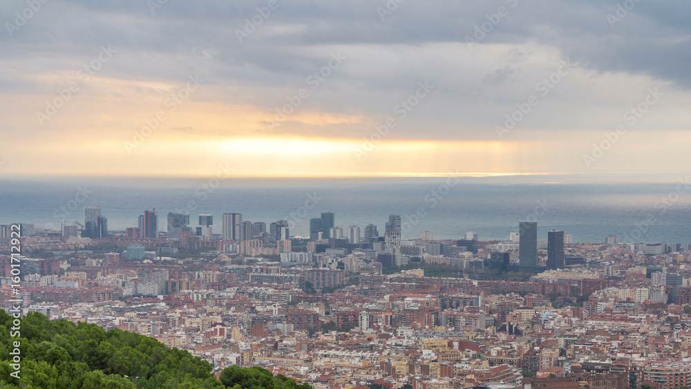 Fototapeta premium Panorama of Barcelona timelapse, Spain, viewed from the Bunkers of Carmel