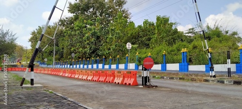 Tablou pe pânză Road barrier: A captivating shot of a barrier system, a vibrant scene