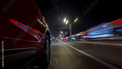 Drivelapse urban look from fast driving car at a night avenue in a city timelapse hyperlapse