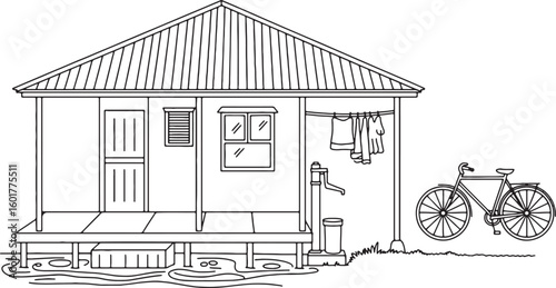 House with bicycle water pump and clothes drying clothesline drying clothes