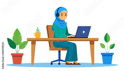 Smiling Muslim woman in a blue hijab and headphones working on a laptop at her desk.