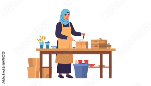Smiling Muslim woman in a light blue hijab and apron preparing food at a wooden table.