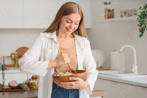 Young woman with tasty okro...