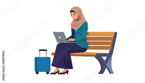 Muslim businesswoman in a hijab working on a laptop, sitting on a bench with her luggage.