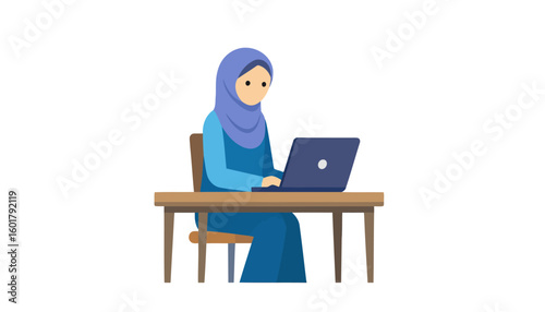 A focused Muslim woman in a blue hijab and dress, sitting at a wooden desk and typing on a laptop.