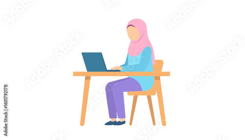 Faceless Muslim woman in a pink hijab and modest clothing working on a laptop at her desk.