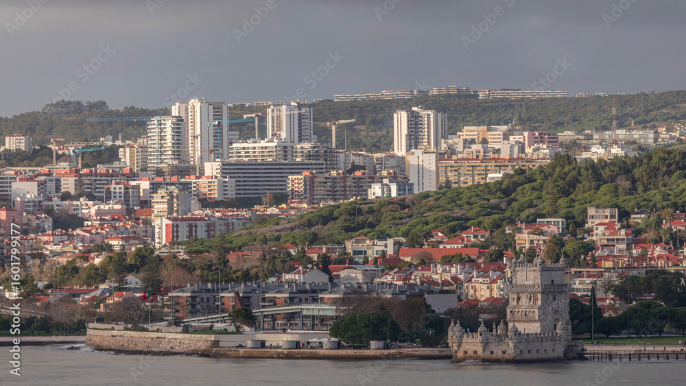 Obraz premium Aerial timelapse of Belem Tower in Lisbon, Portugal, historic landmark on the Tagus River