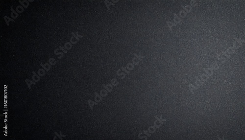 Dark, textured surface with subtle shading