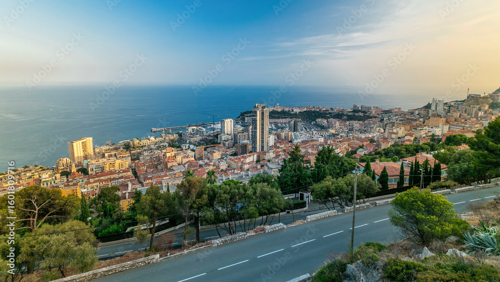 Fototapeta premium Cityscape timelapse of Monte Carlo, Monaco with roofs of buildings during summer sunset.