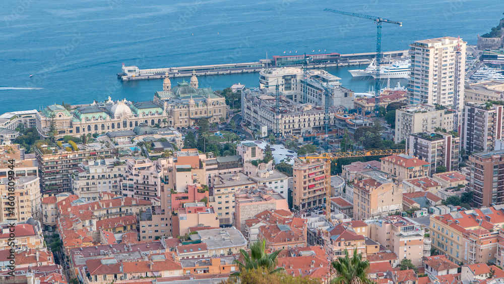 Fototapeta premium Cityscape timelapse of Monte Carlo, Monaco with roofs of buildings during summer sunset.