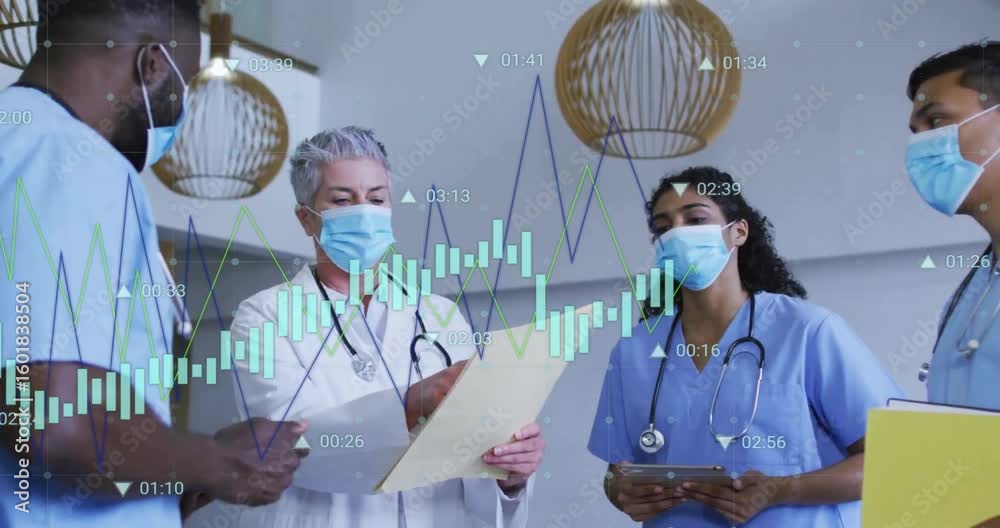Senior doctor unfolding chart and staff reviewing health data for ...