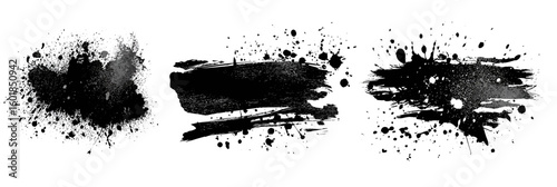 
Black ink brush strokes, paint splashes, and smudges isolated on a white background.