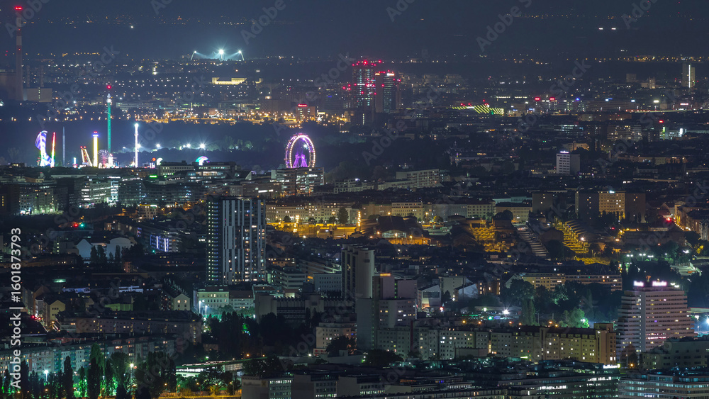 Fototapeta premium Skyline of Vienna from Danube Viewpoint Leopoldsberg aerial night timelapse.