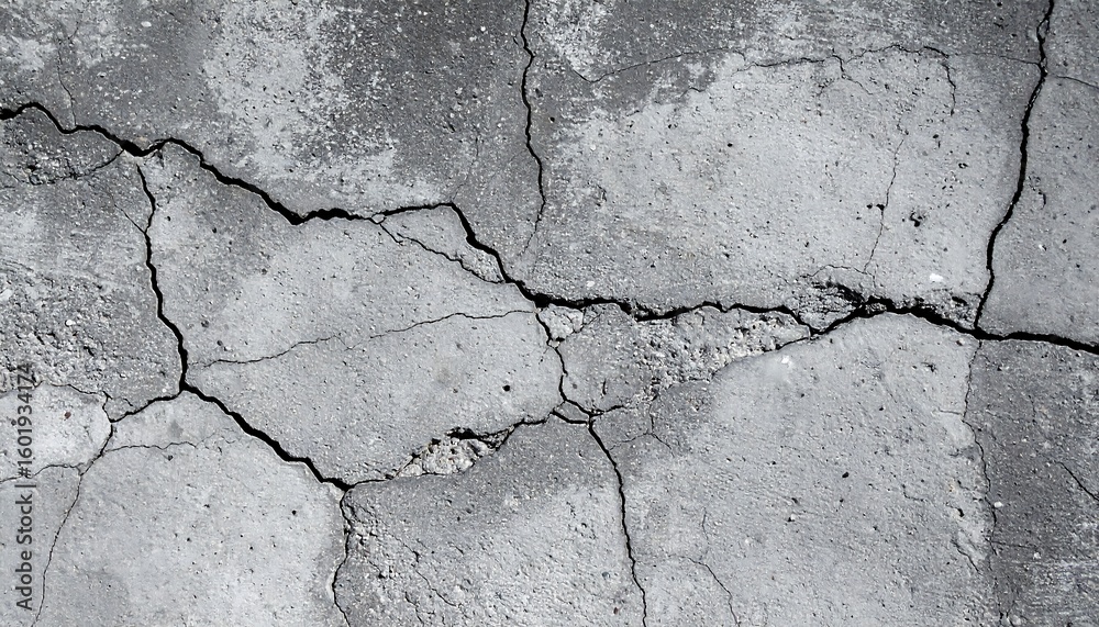 Obraz premium Cracked gray concrete surface