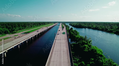 Wallpaper Mural Long-span highway over Louisiana wetlands demonstrates engineered adaptation to rising waters, flood risk, and coastal resilience. Torontodigital.ca