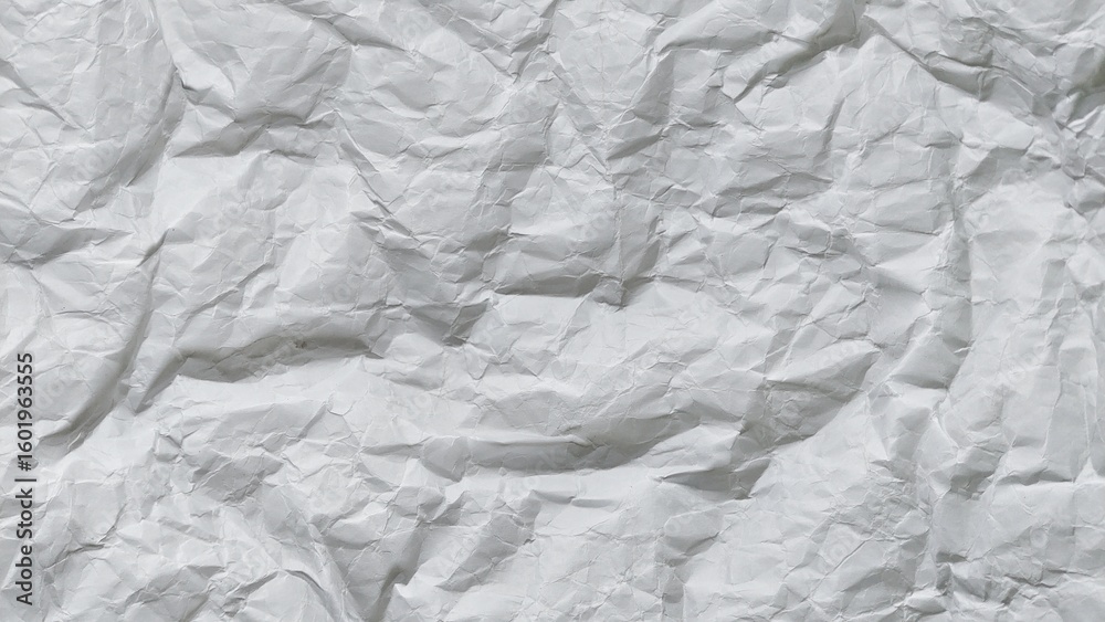 Fototapeta premium Crumpled white paper texture background with wavy surface. Crumpled white vintage paper surface texture for background. Wrinkled paper, abstract background. Paper background with copy space for text.