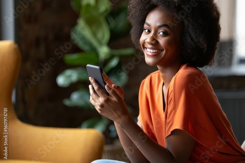 Beautiful african american woman using mobile phone at home smiling and happy face