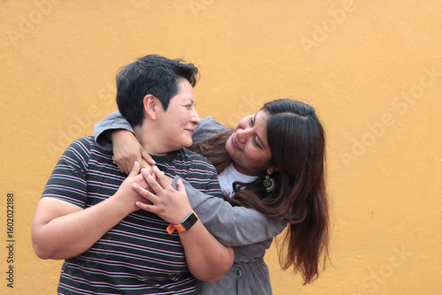 Canvastavla Two dark-skinned Latina lesbians are a couple and show their love with kisses an
