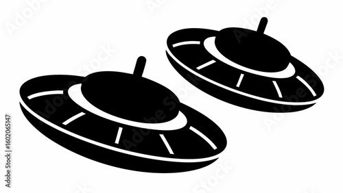 Two black and white ufo spaceships with a classic flying saucer design in a simple vector illustration