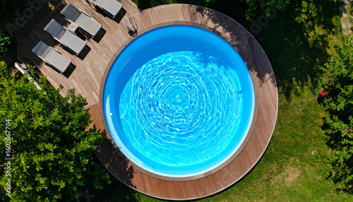 Aerial view round pool backyard.