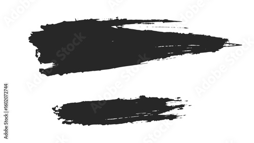 Two black brushstrokes one large and one small with textured edges isolated on a white background