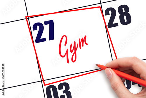 27th day of the month. Hand writing Gym reminder and drawing red frame on calendar with red pen on white background. Concept of fitness planning or workout schedule. Planning and scheduling