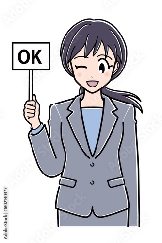 OKの札を持つスーツのOLさん（上半身）