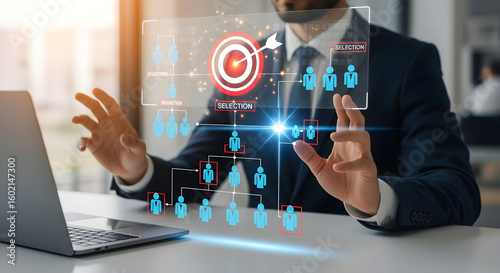 A person's hands gesture towards a glowing holographic organizational chart centered around a bullseye target, with SELECTION prompts, representing strategic human resource selection