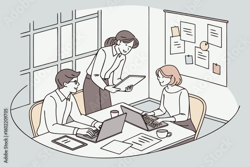 Collaboration occurs in a modern office setting where three professionals engage in discussion while using laptops and a tablet during a productive work session