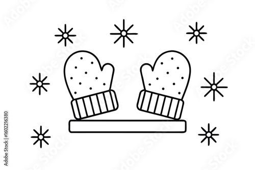 Mittens On Table With Snowflakes