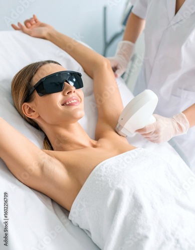 Woman getting laser hair removal on her underarm