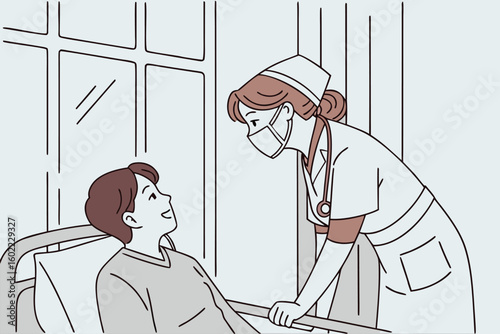 Nurse interacting with a patient in a hospital room during day time, showing care and compassion in a healthcare setting focused on patient comfort and recovery