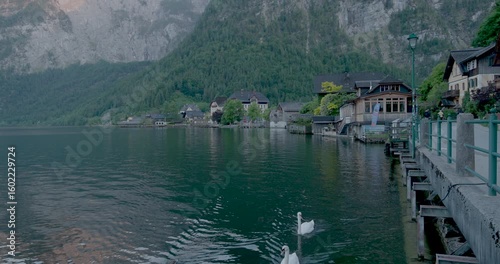 Peaceful lakeside retreat in the mountains with majestic views and tranquil waters at sunset