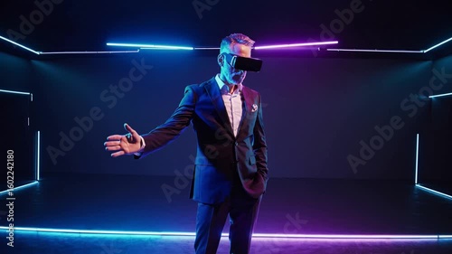 Experience virtual reality in a futuristic setting with a man in a dark suit immersed in technology