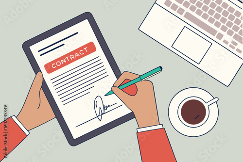 Signing a contract on a tablet while sitting at a desk with a laptop and coffee