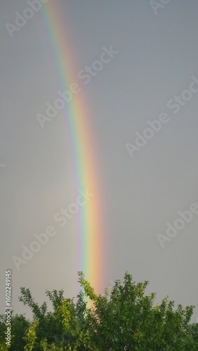 Bright Rainbow in evening stormy sky