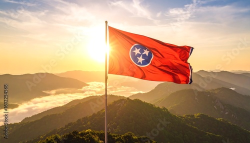 Tennessee flag waving over mountains at sunrise