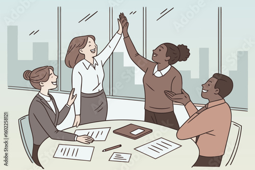 Team members celebrating success in a modern office setting during a collaborative meeting in the late morning light