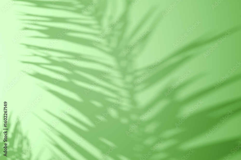 Fototapeta premium Soft shadow of tropical palm leaves on a green background. Minimalistic natural aesthetic, perfect for skincare, wellness, eco-friendly, or summer-themed concepts.