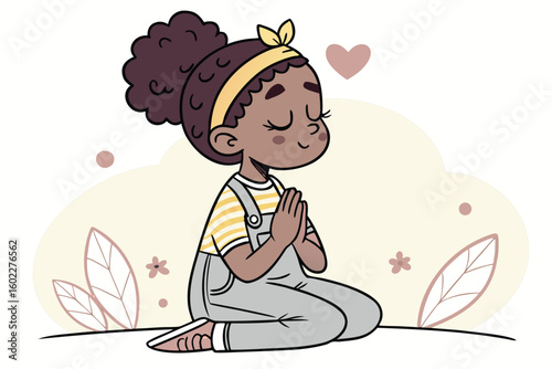 Child with curly hair in a yellow headband kneeling with hands in prayer pose, expressing calmness and tranquility in a serene environment