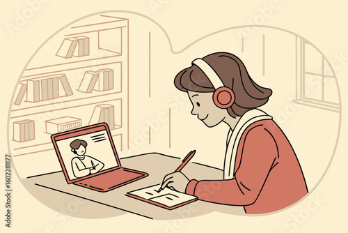 Student engaged in online learning while taking notes during a virtual class session in a cozy study environment with bookshelves in the background