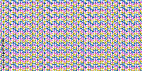 Seamless knitted pattern with rainbow multicolored yarn texture. Handmade, knitted and crocheted.